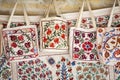 Market stalls with decorative tribal textile with colourful pattern made in Central Asia, Uzbekistan.