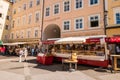 Market stalls and wagons at University square Universitatsplatz in the old town of Salzburg, Austria Royalty Free Stock Photo