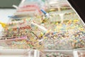 Market stand with boxes of colorful candy sweets and scoops. Low sugar fruit gummies