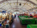 Market tables under an arched tent