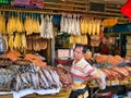 A market trader selling fish around the Central Market in Phnom Penh, Cambodia