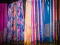 Market of traditional Moroccan scarves and shawls in vibrant colors Royalty Free Stock Photo