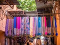 Market of traditional Moroccan scarves and shawls in vibrant colors Royalty Free Stock Photo