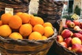 Market vendor cart with varied fruit in wicker baskets Royalty Free Stock Photo