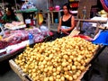 Market vendor selling fruits in a market in philippines