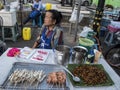 Market vendor selling Insect larvae