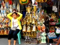 Market vendor selling religious items beside quiapo church in the philippines