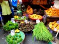 Market vendor selling vegetables in a market in philippines