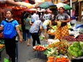 Market vendor selling vegetables in a market in philippines