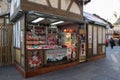 Market vendor stall selling Christmas fragrances and gifts in an outdoor market setting