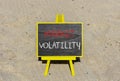 Market volatility symbol. Concept words Market volatility on beautiful black chalk blackboard. Chalkboard. Beautiful sand Royalty Free Stock Photo