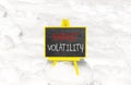 Market volatility symbol. Concept words Market volatility on beautiful black chalk blackboard. Chalkboard. Beautiful snow Royalty Free Stock Photo