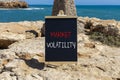 Market volatility symbol. Concept words Market volatility on beautiful black chalk blackboard. Chalkboard. Beautiful stone sea sky Royalty Free Stock Photo