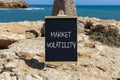 Market volatility symbol. Concept words Market volatility on beautiful black chalk blackboard. Chalkboard. Beautiful stone sea sky Royalty Free Stock Photo