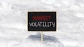 Market volatility symbol. Concept words Market volatility on beautiful black chalk blackboard. Chalkboard. Beautiful snow Royalty Free Stock Photo