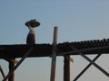 A Market Woman Crosses U-Bein Bridge, Amarapura, Mandalay, Myanmar Royalty Free Stock Photo