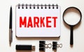 market words on spring white note book Royalty Free Stock Photo