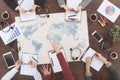 Marketers sitting at table with map Royalty Free Stock Photo