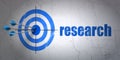 Marketing concept: target and Research on wall background