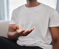 Marketing, product placement and hands of a man advertising with palm on the sofa in a house lounge. Branding, logo and Royalty Free Stock Photo