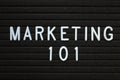 Marketing 101 in white letters on a notice board Royalty Free Stock Photo