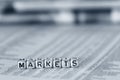 Markets on beads on the stocks and shares page of a newspaper Royalty Free Stock Photo