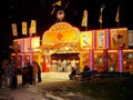 People gather at the entrance to the Midway at the Markham Fair.