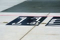 Marking for ground transportation on the airport apron among taxiways Royalty Free Stock Photo