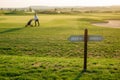 marking the holes on the golf course