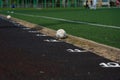 Marking the rubber track of the stadium. Meters on the treadmill. School Stadium