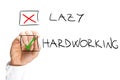 Marking X on Lazy and Check on Hardworking Royalty Free Stock Photo
