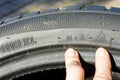 Markings on the sidewall of a new winter tire, speed, load, rotation, mud and snow designations