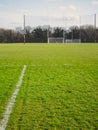 Markings on a training field in focus, Two goalposts for Irish National sport out of focus