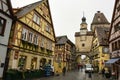 Markus Tower Markusturm on narrow street with half-timbered houses in Rothenburg ob der Tauber, Bavaria, Germany Royalty Free Stock Photo