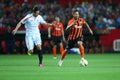 Marlos runs away with a ball from Grzegorz Krychowiak