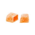 Marmalade candy sliced into two parts on white