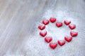 Marmalade in the form of hearts laid out in the shape of a large heart on wooden boards