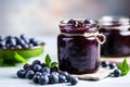 Marmalade or jam in jar with blueberry fruits