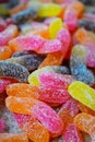 Marmalade multicolored worms, sweets, harmful food. Background.