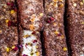 Marmalade sticks sprinkled with chocolate and dried berries. Indian and oriental sweets