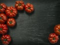 Marmande tomatoes on slate background Royalty Free Stock Photo