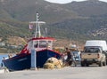 Marmari, Evia island, Greece. August 2020: Fishermen and fishing boats at the Marina of the resort town of Marmari on the Greek i