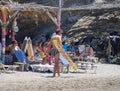 Marmari, Evia island, Greece. August 2020: Holidaymakers and tourists relax on beach loungers and in cafes on the beach on the Gre