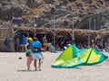 Marmari, Evia island, Greece. August 2020: An instructor trains a girl to operate a kite parachute on the beach of the Greek isla