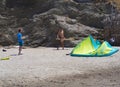 Marmari, Evia island, Greece. August 2020: Male instructor folds kite parachute on the beach of the Greek island of Evia in the A