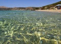 Marmari, Evia island, Greece. August 2020:  View of a Grand sandy beach in the Aegean sea with holidaymakers and tourists on the G Royalty Free Stock Photo