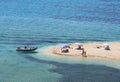 Marmari, Evia island, Greece. August 2020: View of a Grand sandy beach in the Aegean sea with holidaymakers and tourists on the Gr Royalty Free Stock Photo