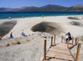 Marmari, Evia island, Greece. August 2020: View of a Grand sandy beach in the Aegean sea with holidaymakers and tourists on the Gr Royalty Free Stock Photo