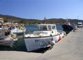 Marmari, Evia island, Greece. August 2020: White fishing boat with an awning in the port of the Greek resort town of Marmari on th Royalty Free Stock Photo