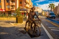 MARMARIS, TURKEY: A modern monument of a guy and a girl riding a bicycle on the street in Marmaris.